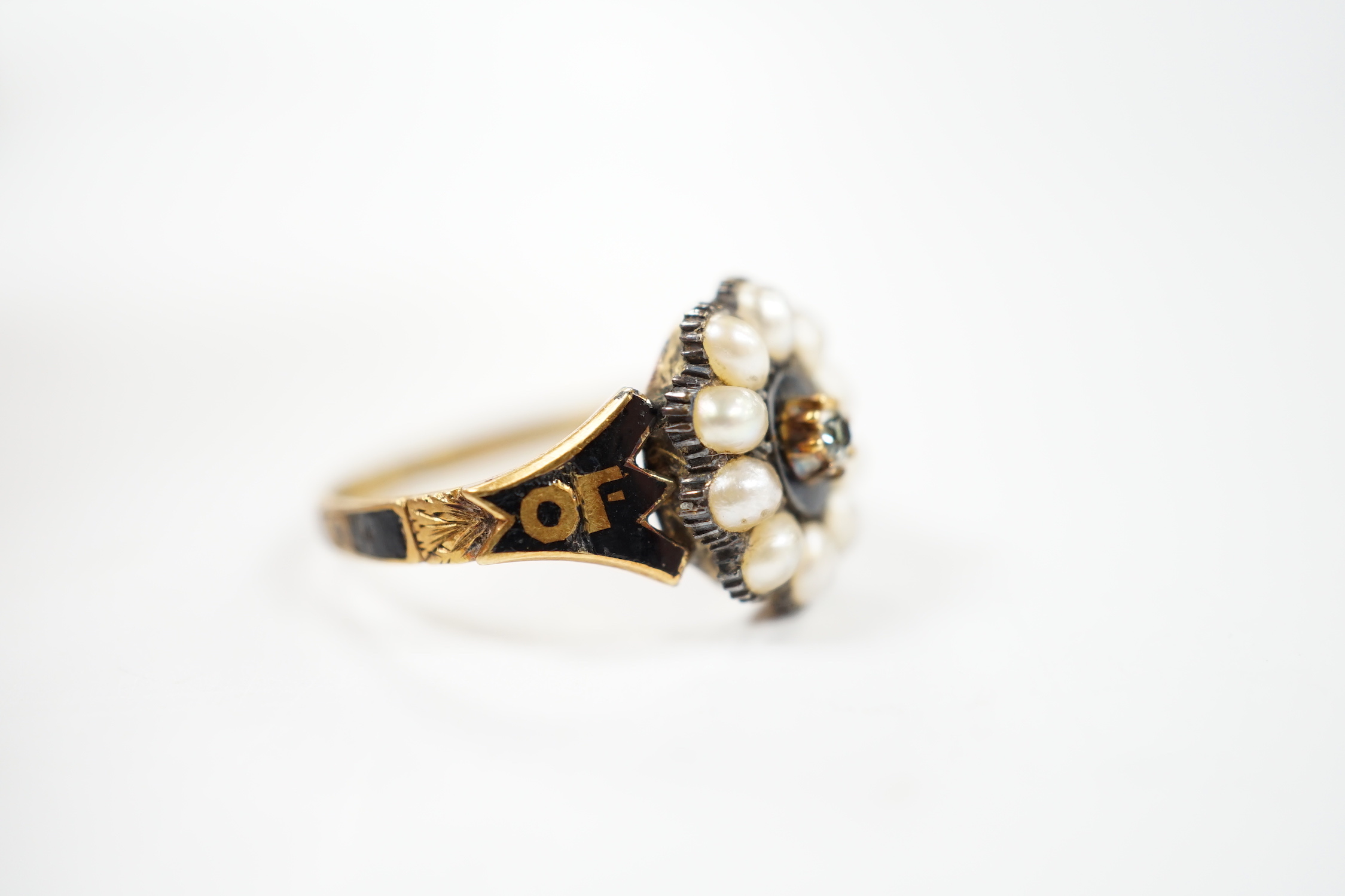 A Victorian 18ct gold, diamond, split pearl and black enamel set mourning ring, size O, gross weight 3.5 grams.